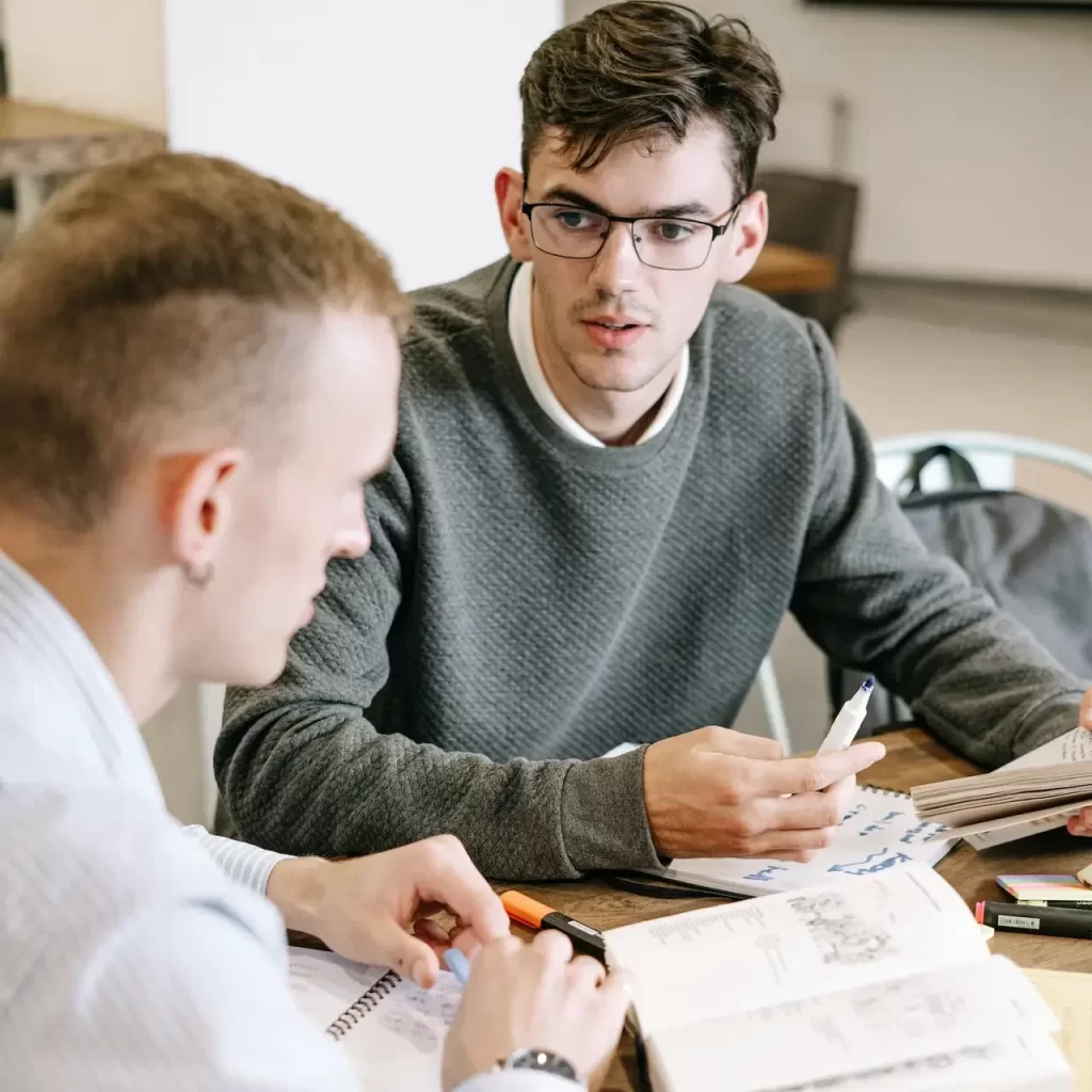 Two young men studying together during an MCAT tutoring session.